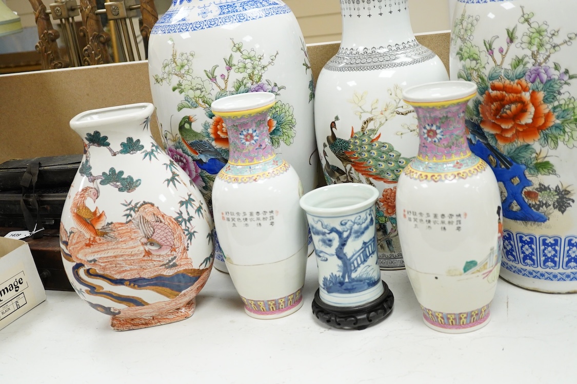 A large pair of Chinese polychrome vases, 60cm high, a pair of famille rose vases, a blue and white brushpot and two other vases (7).